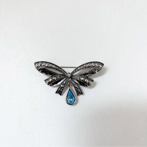 Vintage Avon Silver-Tone Bow Brooch with Blue Teardrop Accent
